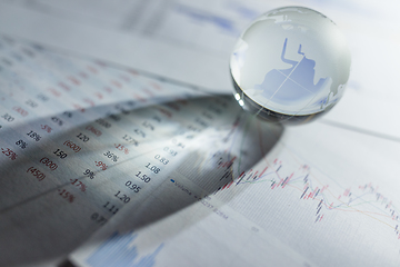 Image showing Glass globe with stock charts