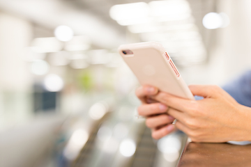 Image showing Woman touch on cellphone in a station