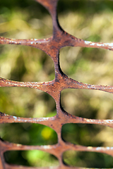 Image showing Rusty metal fence