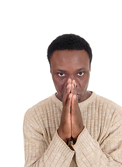 Image showing Praying African man in a portrait image