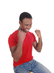 Image showing Happy African man with fists, smiling