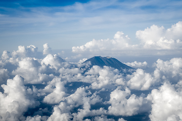 Image showing Airplane flying above Mount Agung volcano, Bali, Indonesia