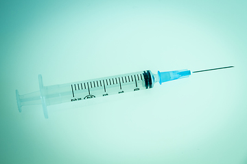 Image showing Syringe on blue background