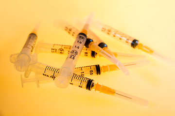 Image showing Syringes on orange background