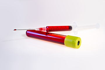 Image showing Syringe and tube with blood on white background