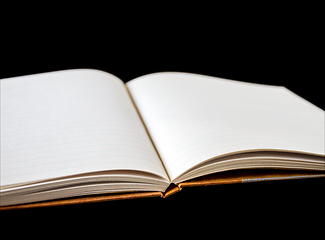 Image showing Open blank notebook on black background