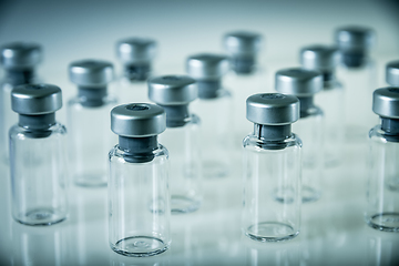 Image showing Vaccine glass bottles on grey background