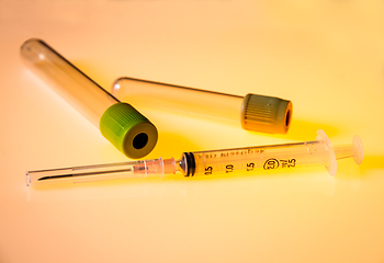 Image showing Empty blood test tubes and syringe
