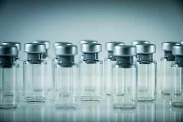 Image showing Vaccine glass bottles on grey background