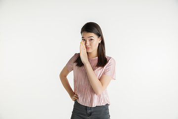 Image showing Beautiful girl\'s half-length portrait on white studio background