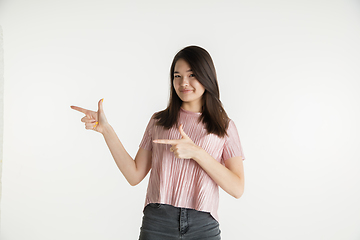 Image showing Beautiful girl\'s half-length portrait on white studio background