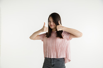 Image showing Beautiful girl\'s half-length portrait on white studio background