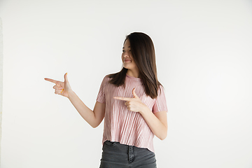 Image showing Beautiful girl\'s half-length portrait on white studio background