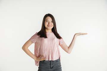 Image showing Beautiful girl\'s half-length portrait on white studio background