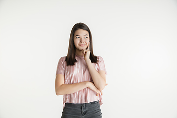 Image showing Beautiful girl\'s half-length portrait on white studio background