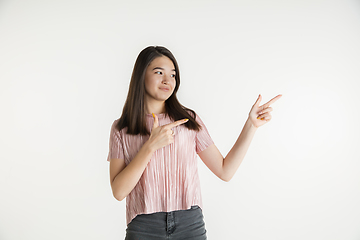 Image showing Beautiful girl\'s half-length portrait on white studio background