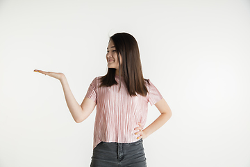 Image showing Beautiful girl\'s half-length portrait on white studio background