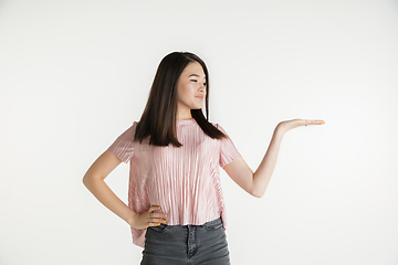 Image showing Beautiful girl\'s half-length portrait on white studio background