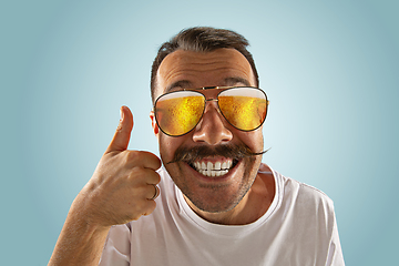 Image showing Oktoberfest man with sunglasses full of light beer