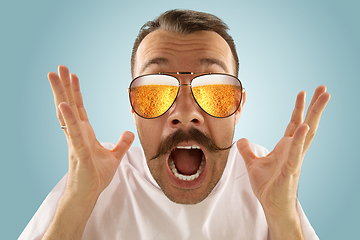 Image showing Oktoberfest man with sunglasses full of light beer