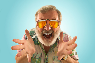 Image showing Oktoberfest senior man with sunglasses full of light beer