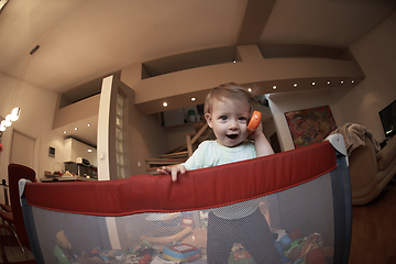 Image showing cute little baby playing in mobile bed