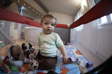 Image showing cute little baby playing in mobile bed