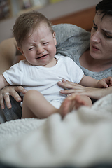 Image showing mother is playing with baby at home