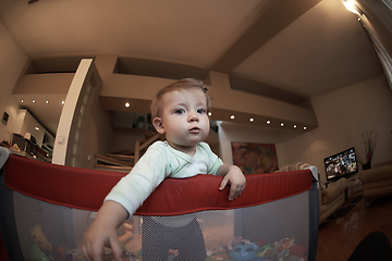 Image showing cute little baby playing in mobile bed