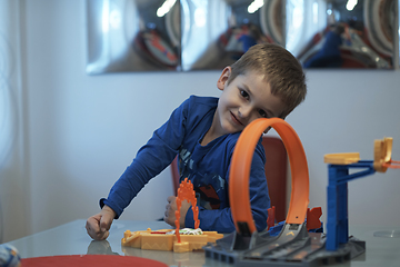 Image showing Father and children playing car toy game