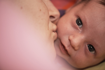 Image showing One month newborn baby sleeping in bed