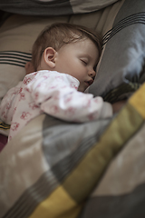 Image showing newborn baby sleeping at home in bed