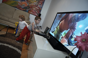 Image showing Little child playing with sister at home