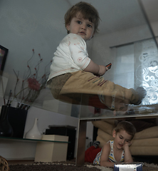 Image showing Little child playing with sister at home