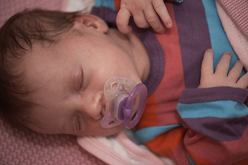 Image showing One month newborn baby sleeping in bed