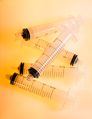 Image showing Syringes on orange background
