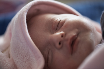 Image showing One month newborn baby sleeping in bed