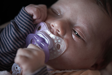 Image showing One month newborn baby sleeping in bed