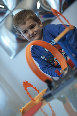 Image showing Father and children playing car toy game