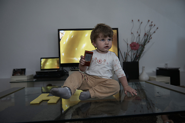 Image showing Adorable cute beautiful little baby girl playing with toys at home