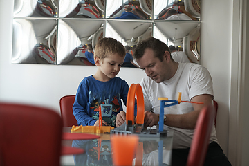 Image showing Father and children playing car toy game