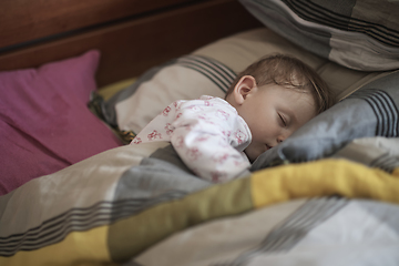 Image showing newborn baby sleeping at home in bed