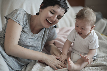 Image showing mother is playing with baby at home