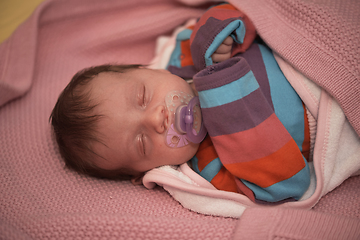 Image showing One month newborn baby sleeping in bed