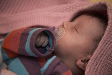 Image showing One month newborn baby sleeping in bed