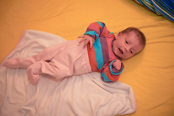 Image showing One month newborn baby sleeping in bed