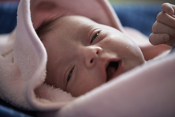 Image showing One month newborn baby sleeping in bed