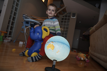 Image showing Little boy child playing with creative toys
