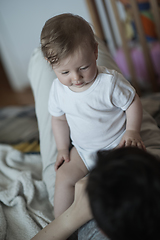 Image showing mother is playing with baby at home