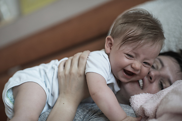 Image showing mother is playing with baby at home